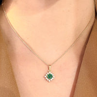 Emerald and diamond pendant in 14 carat gold