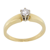 Diamond solitaire ring in yellow and white gold