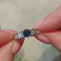 White gold ring with baguette diamonds and sapphire