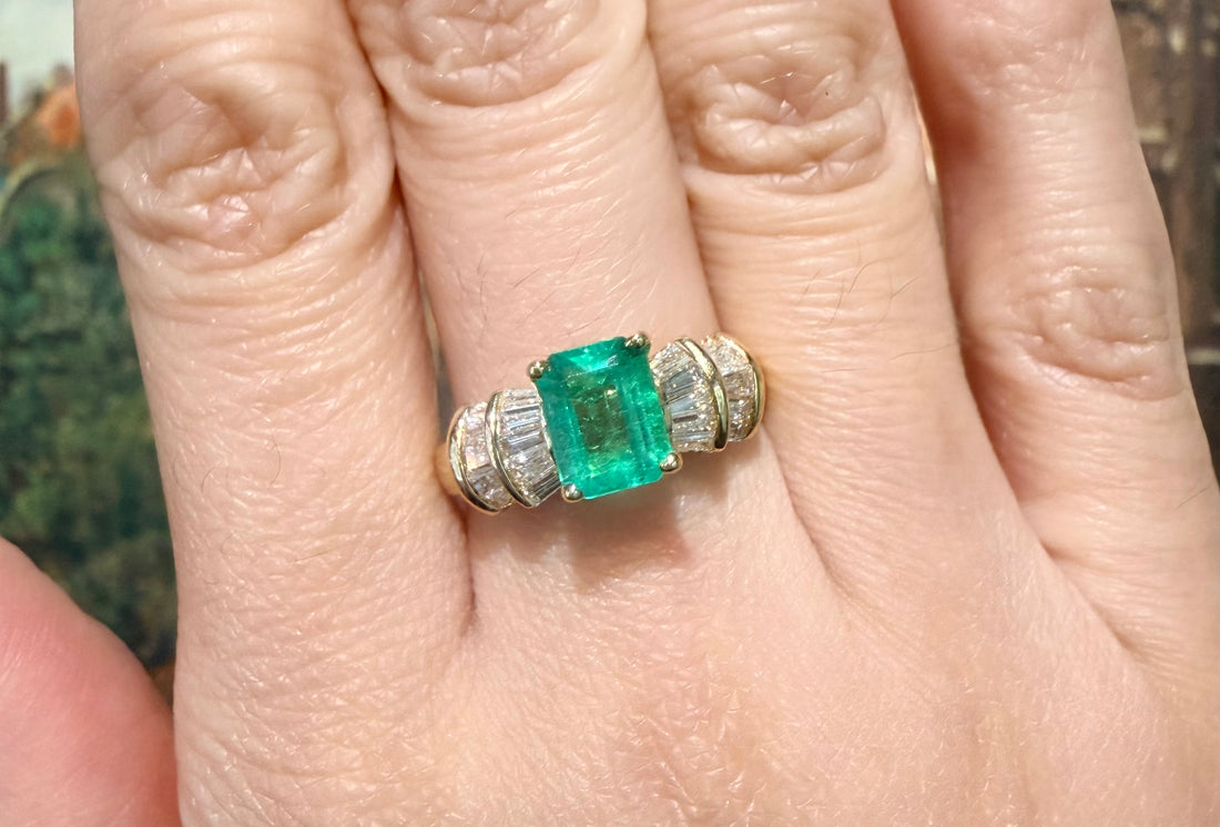 Emerald and baguette cut diamond ring in 18 carat gold
