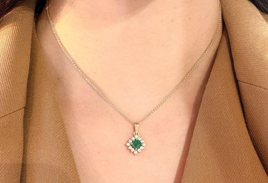 Emerald and diamond pendant in 14 carat gold