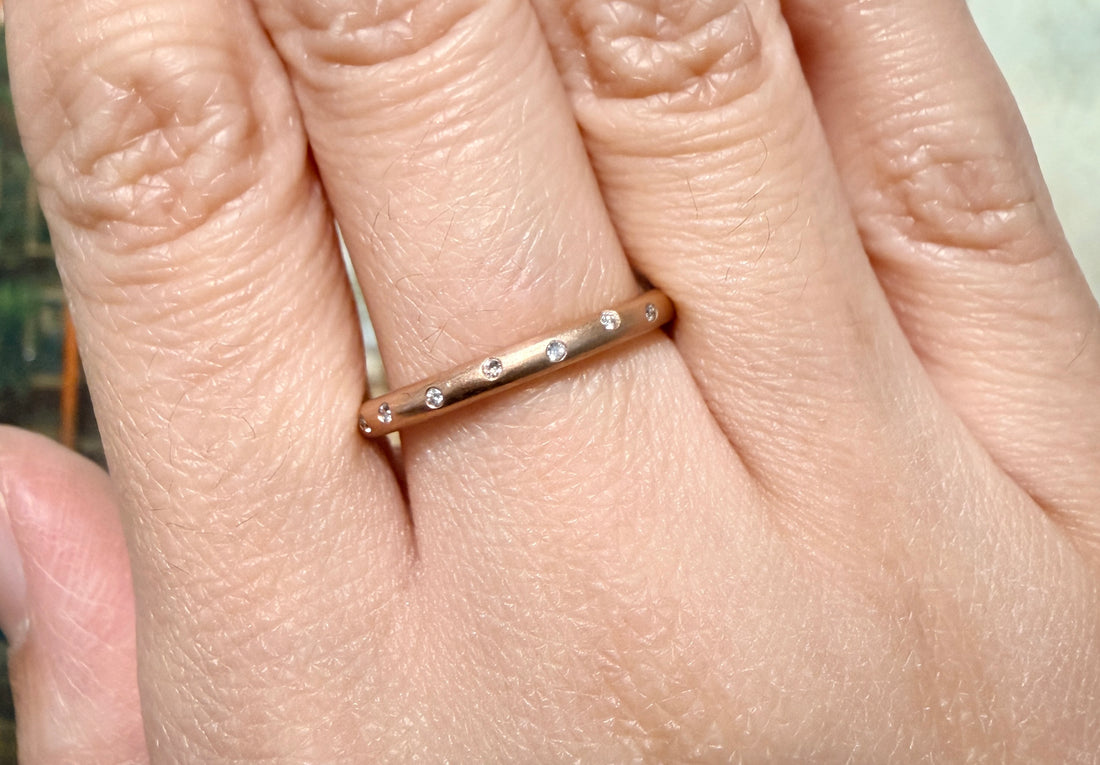 14 carat gold band with diamonds