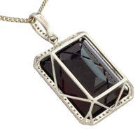 Garnet and diamond pendant in white gold