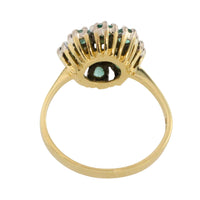 Vintage emerald and diamond cluster ring