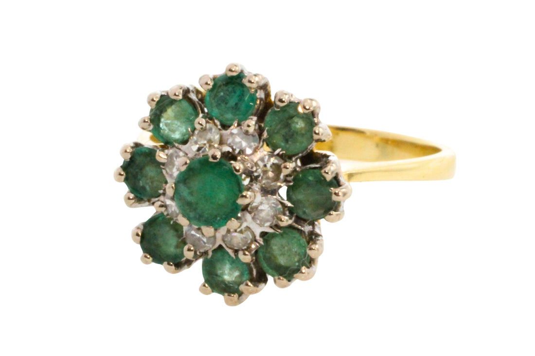 Vintage emerald and diamond cluster ring