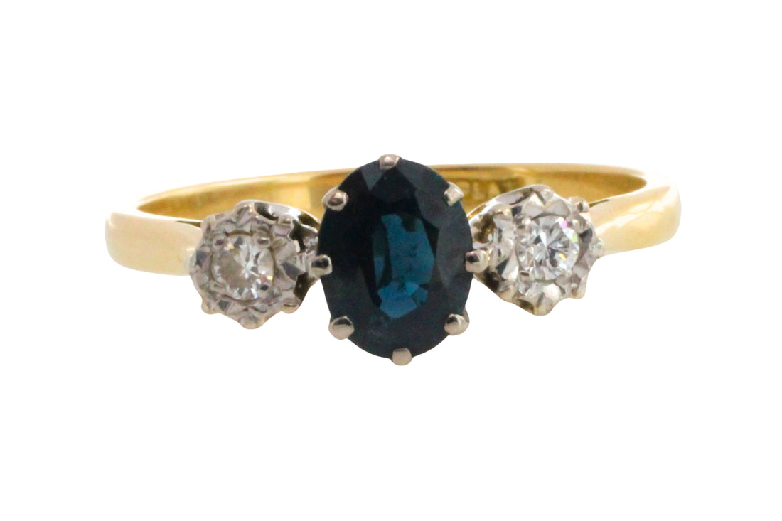 Vintage three stone sapphire and diamond ring