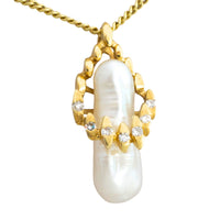 Baroque pearl and diamond pendant in 14 carat gold