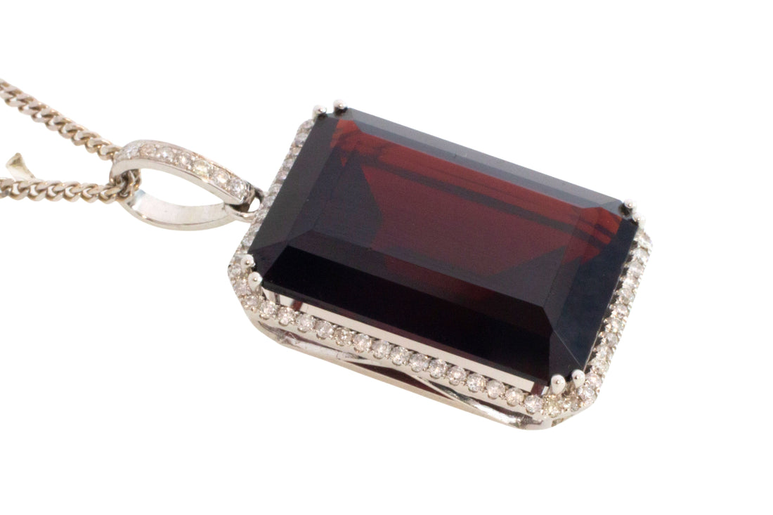 Garnet and diamond pendant in white gold