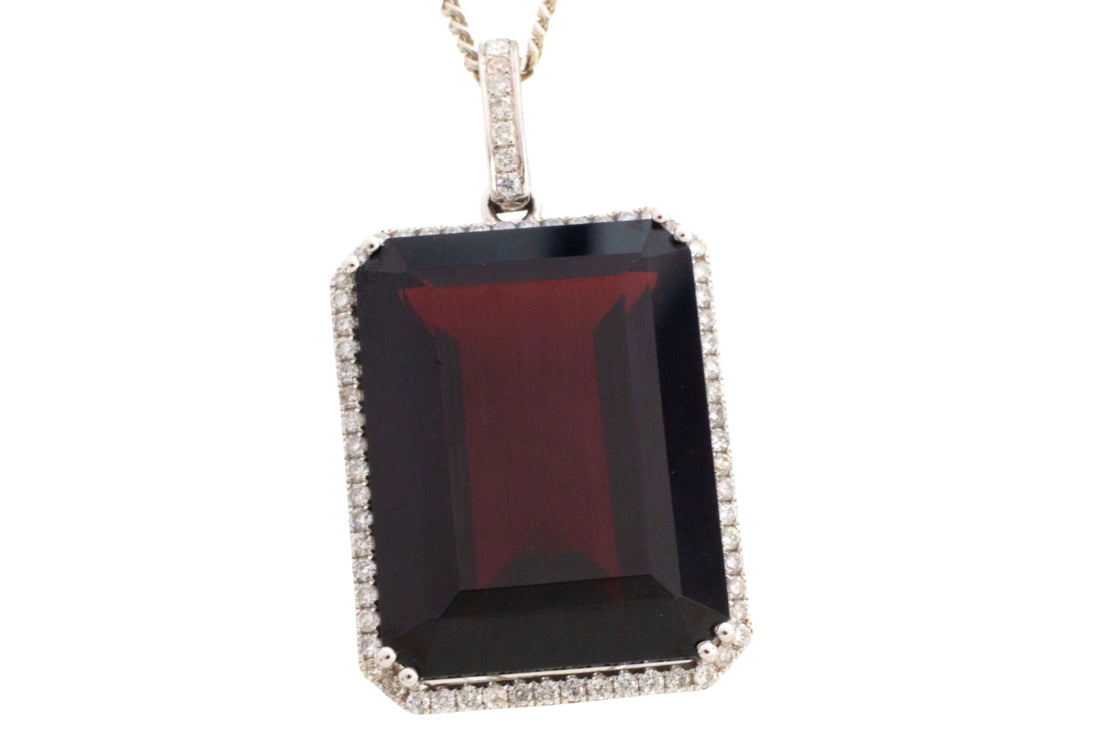 Garnet and diamond pendant in white gold