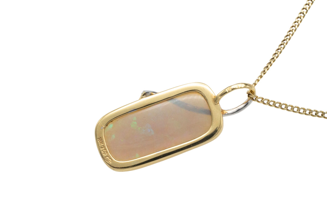 Opal and diamond pendant in 18 carat gold