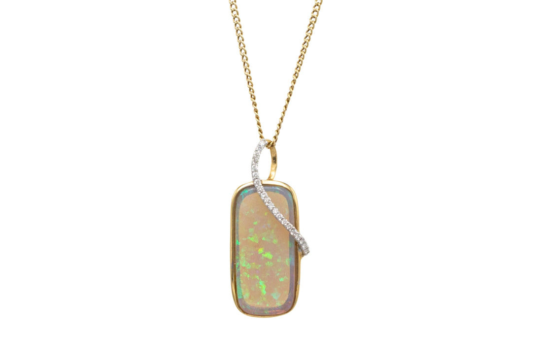 Opal and diamond pendant in 18 carat gold