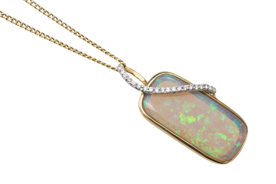 Opal and diamond pendant in 18 carat gold