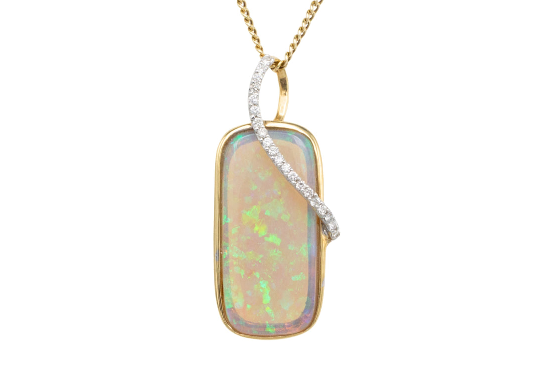 Opal and diamond pendant in 18 carat gold