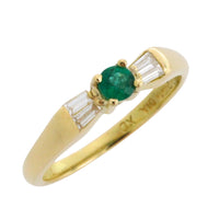 Emerald and baguette diamond ring in 18 carat gold