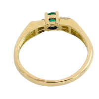 Emerald and baguette diamond ring in 18 carat gold