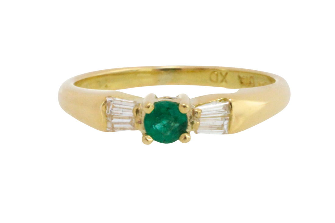 Emerald and baguette diamond ring in 18 carat gold