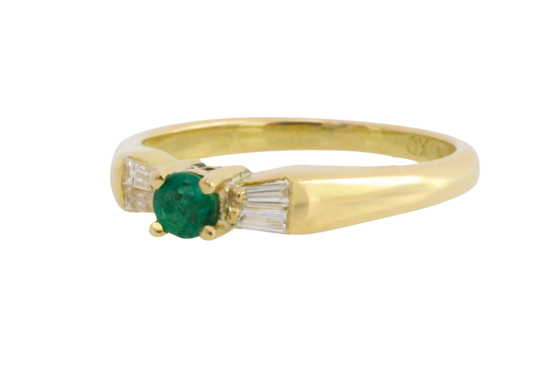 Emerald and baguette diamond ring in 18 carat gold