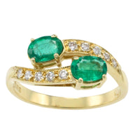 Vintage smaragd en diamanten kruiszetting ring