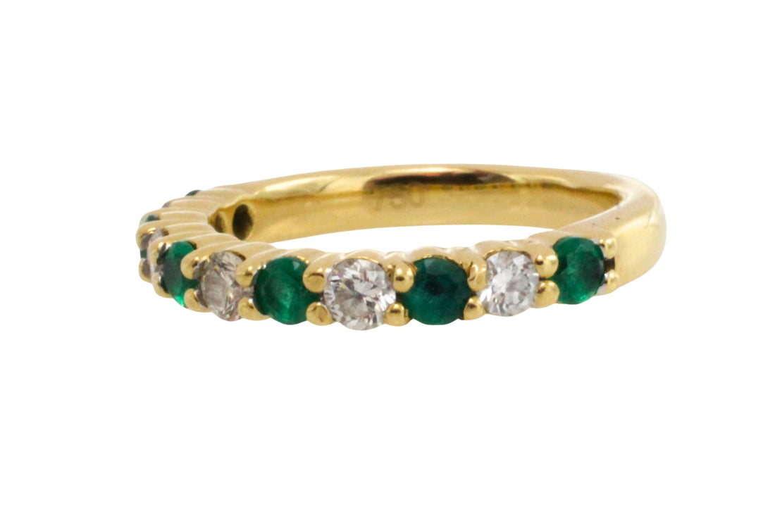 Emerald and diamond band in 18 carat gold