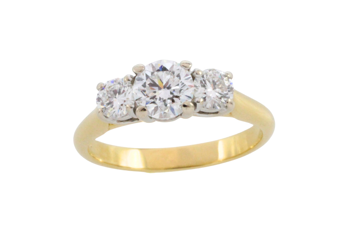 Three stone brilliant cut diamond ring