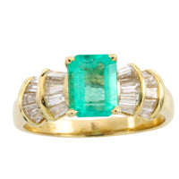 Emerald and baguette cut diamond ring in 18 carat gold