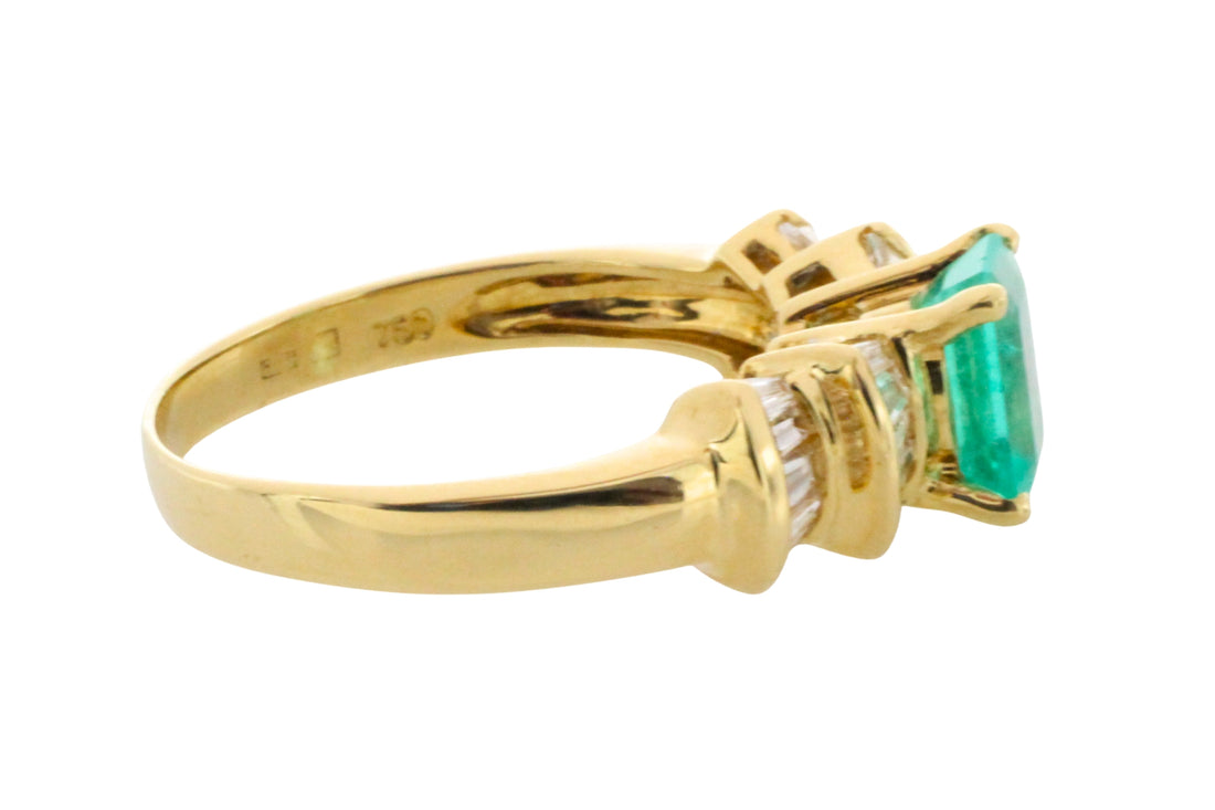 Emerald and baguette cut diamond ring in 18 carat gold