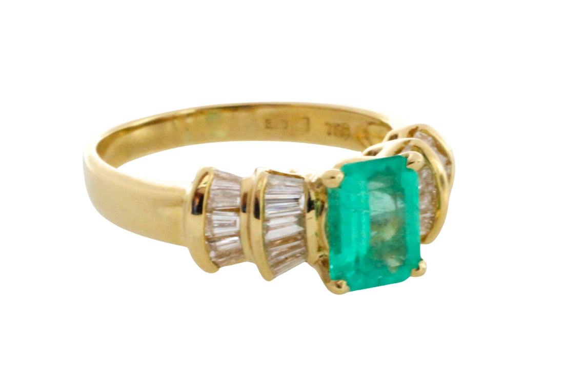 Emerald and baguette cut diamond ring in 18 carat gold