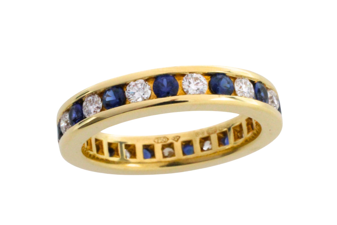 Sapphire and diamond eternity band in 18 carat gold