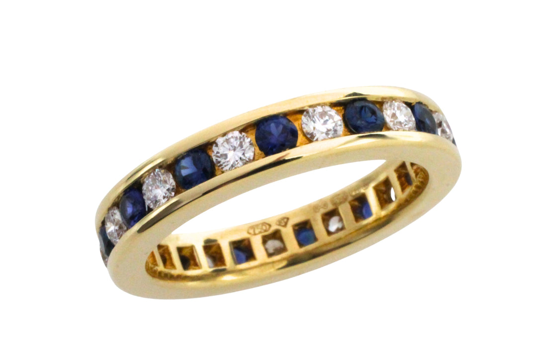 Sapphire and diamond eternity band in 18 carat gold