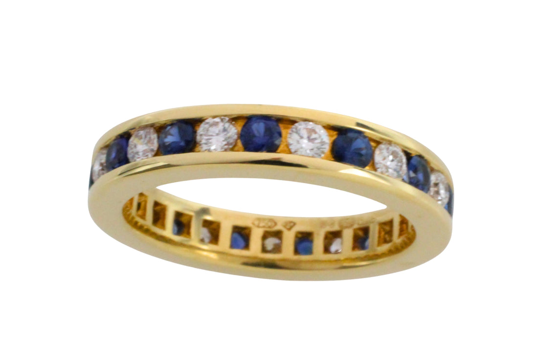 Sapphire and diamond eternity band in 18 carat gold
