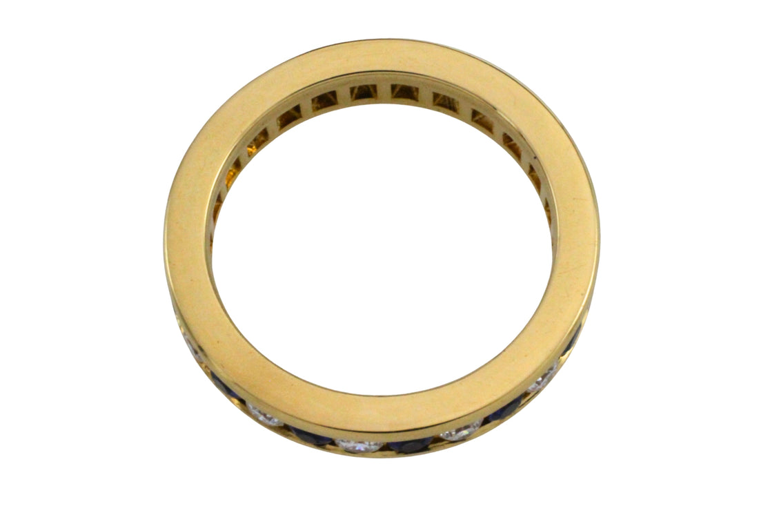 Sapphire and diamond eternity band in 18 carat gold