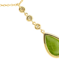 Peridot and diamnd pendant in 18 carat gold