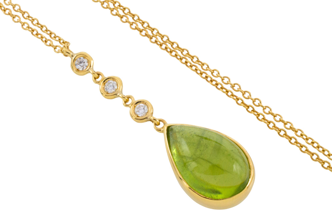 Peridot and diamnd pendant in 18 carat gold