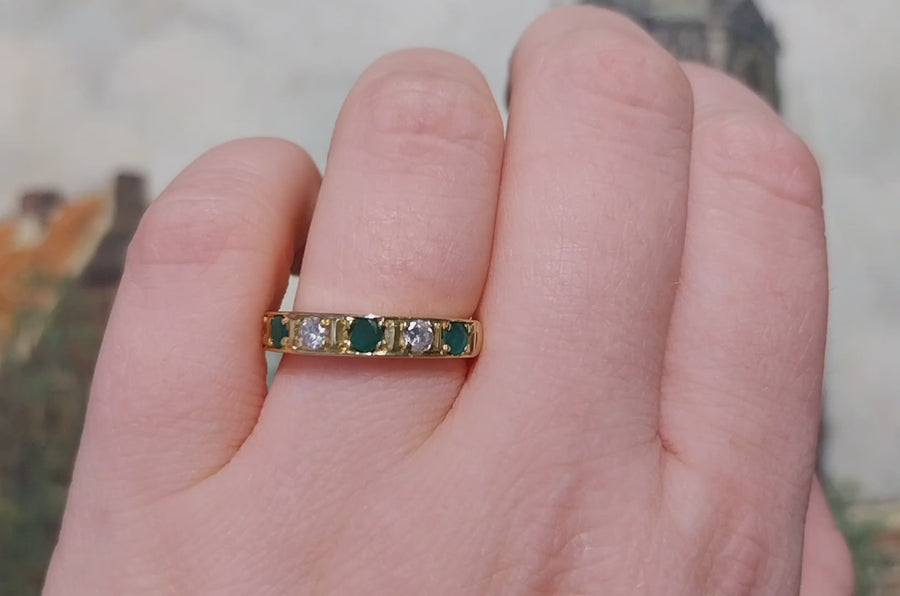 18 carat gold band with emeralds and diamonds