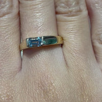 14 carat gold ring with aquamarine stone