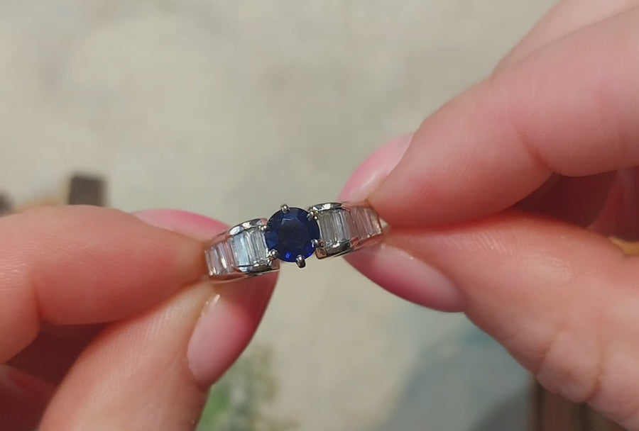 White gold ring with baguette diamonds and sapphire