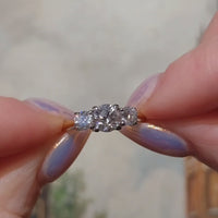 Three stone brilliant cut diamond ring