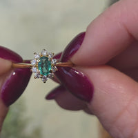 Emerald and diamond cluster ring in 18 carat gold