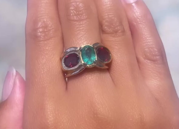 Emerald and garnet ring in 18 carat gold