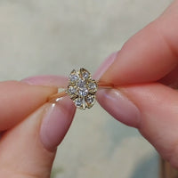 Oval diamond cluster ring in 14 carat gold