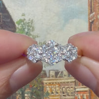 Diamond triple cluster ring in 18 carat gold