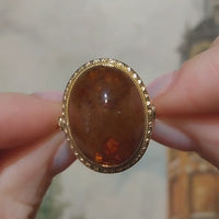 Cabochon amber ring in 18 carat gold