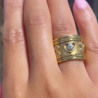 An 18 carat gold Elizabeth Gage style ring with diamonds