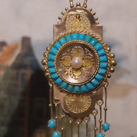 Antique 18 carat gold pendant / brooch with turquoise and a pearl