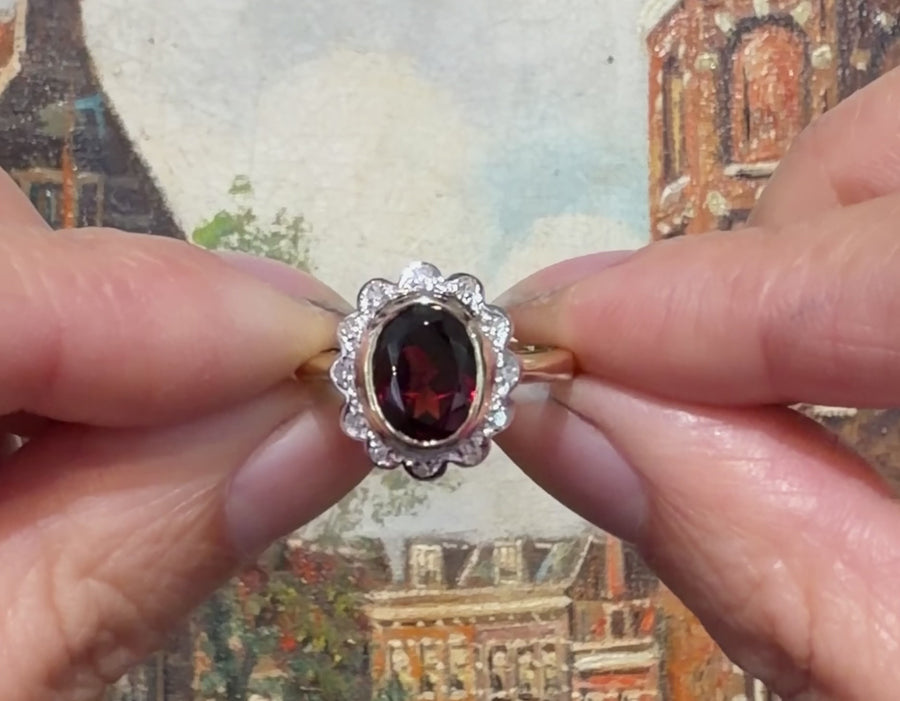 Garnet and diamond ring in 14 carat gold